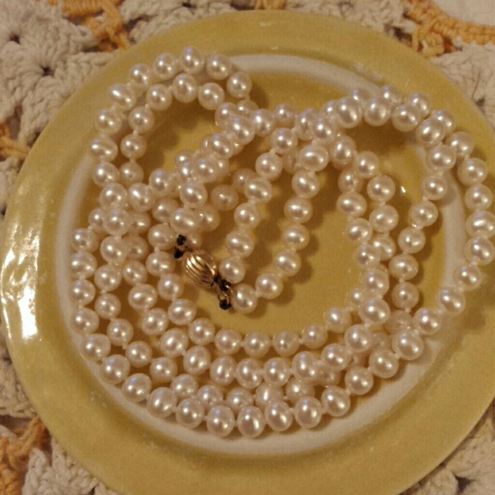 Pearl Necklace; Freshwater with 14k yellow clasp.
